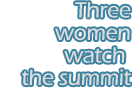 Three women watch the summit